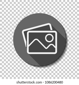 Stack of pictures with couple of mountains and sun. Simple linear icon. White flat icon with long shadow in circle on transparent background. Badge or sticker style