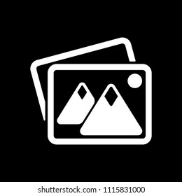 Stack of pictures with couple of mountains and sun. Simple icon. White icon on black background. Inversion
