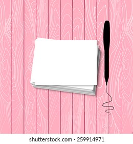 Stack white paper isolated on Pink wooden background.Top view.
