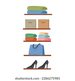 Stacked clothes, shoes and boxes on shelves. Clothes in wardrobe 