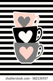 Stacked cute coffee cups in black, gray and pastel pink on striped background.