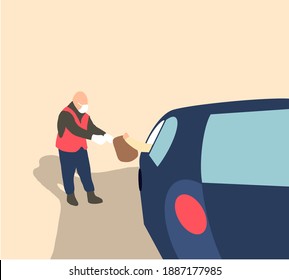 Staff with face mask giving bakery bag through car window to customer at drive thru service station. Drive thru is popular service after coronavirus covid-19 pandemic.