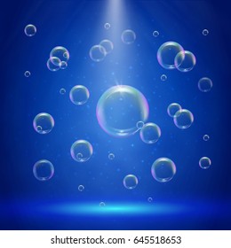 Stage illumination with spotlights and bubbles. Blue deep sea scene with shampoo foam in water. Colorful realistic bubble with sprays and rays. Background with liquid cleaning soap for bath and shower