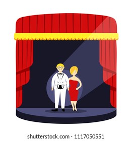 Stage podium with lighting,curtains.Creative man and woman giving talk on stage to audience.Man in white suit and woman in evening dress on stage.Actors,comedians,lady,gentleman.Speech,show hosts.