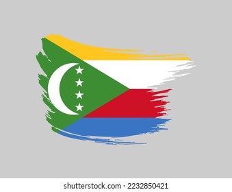 Stain brush painted stroke flag of Comoros on isolated background