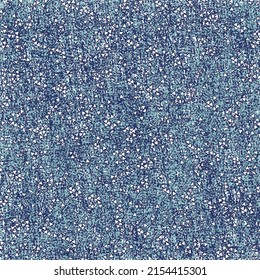 Stained blue background sprinkled with tiny triangle-shaped particles. Mottled texture. Seamless pattern.