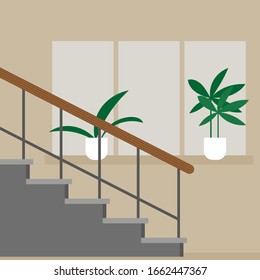 Staircase against the background of a wall with a window and plants