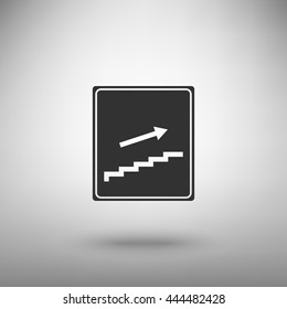 Stairs sign with arrow. Dark gray icon with shadow on floor.