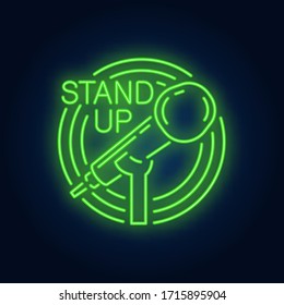 Stand up neon sign. Stand microphone in round frame on brick wall background. Night bright advertisement. Vector illustration in neon style for comedy show