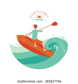 Stand Up Paddle Surfing. Young boy rides on big green wave.