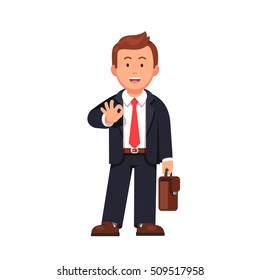 Standing business man with a briefcase showing OK gesture with his right hand. It'll be okay says confident businessman. Flat style vector illustration isolated on white background.