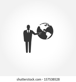 Standing businessman pointing  on the globe - vector icon