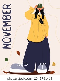 standing girl in green cap yellow free shirt and wide blue pants with gray sneakers around her fallen leaves and the inscription november