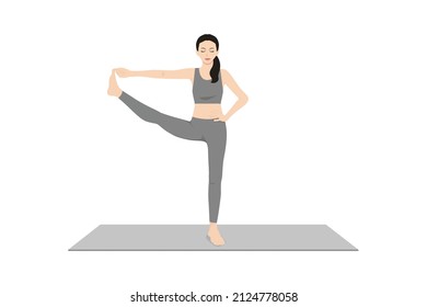 Standing Hand to Big Toe Pose. Beautiful girl practice Utthita Hasta Padangusthasana. Young attractive woman practicing yoga exercise. working out, black wearing sportswear, grey pants and top, indoor