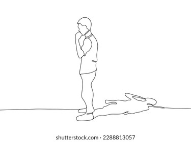 A standing man casts a shadow in the form of a soldier. Military theme. International Conscientious Objectors' Day. One line drawing for different uses. Vector illustration.