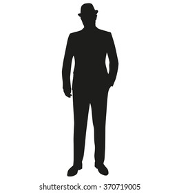 Standing man in suit and hat. Hand in pocket. Vector silhouette