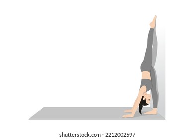 Standing Split Pose Variation At Wall. Beautiful girl practice Hanumanasana Variation At Wall. Young attractive woman practicing yoga exercise. working out, black wearing sportswear, grey pants
