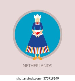 Standing young woman wearing traditional Dutch costume dress, apron, bonnet and klompen.