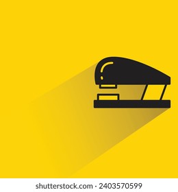 stapler icon with shadow on yellow background