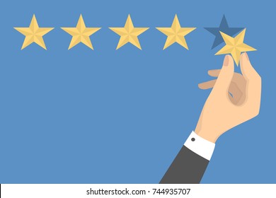 Star quality rating. Hand picking the star for review.