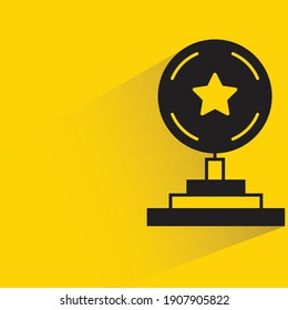 star trophy with shadow on yellow background