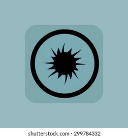 Starburst in circle, in square, on pale blue background