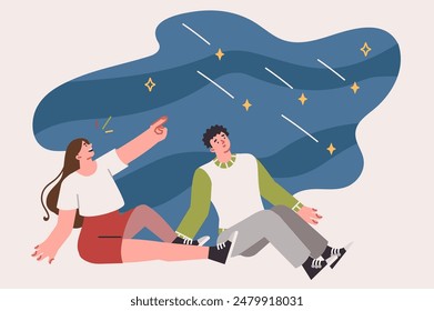 Starfall over heads of couple sitting on ground and admiring stars in sky, enjoying romantic atmosphere. Date between young guy and girl takes place in fresh air at moment of starfall