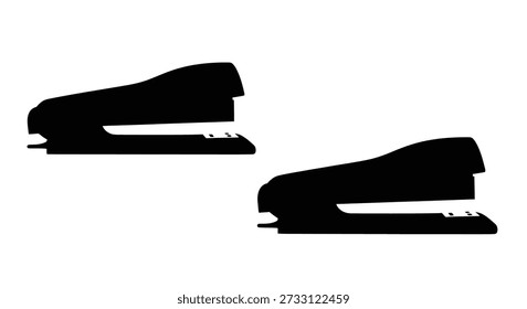 A stark black silhouette of a stapler and its base, showcasing a distinctive cutout style.