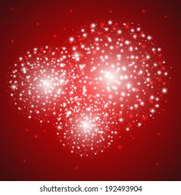 Starry fireworks on red background
