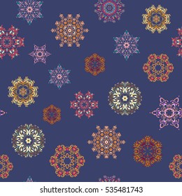 Starry Sky. Falling snow. Seamless texture with stylized snowflakes and dots on a blue background.