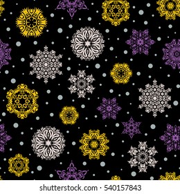Starry Sky. Falling snow. Seamless texture with yellow and purple snowflakes and dots on a black background.