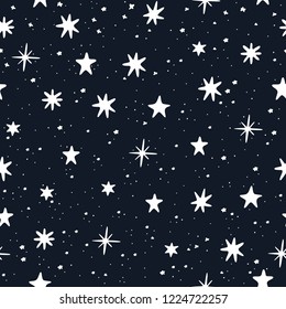 Starry sky hand drawn. White stars on blue background. Seamless pattern.  Vector illustration.
