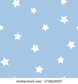Starry sky seamless pattern. White stars on a blue background. Vector simple childish hand-drawn background in cartoon style. ideal for textiles and baby clothes.