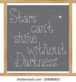 Stars can't shine without darkness. Hand drawn motivational lettering quote on the chalkboard. 