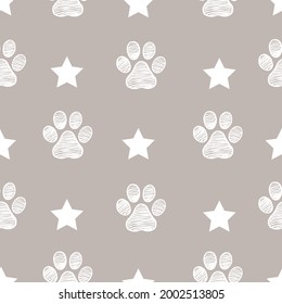 Stars with doodle white paw prints and stars seamless fabric pattern