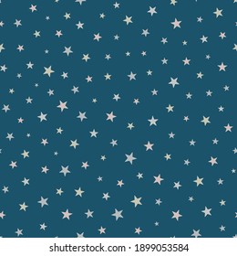 The stars ragless, seamless pattern. A light coloured elements on dark blue background. Packaging, wallpaper