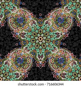 Stars seamless pattern in orange and green and black colors. Abstract vector bright design for wallpaper, Christmas decoration, confetti, textile, wrapping. Symbol of holiday.