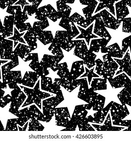 Stars with splash seamless vector pattern. Black and white cosmic, space background. Free hand drawn star shapes and chaotic blots or speckles. Cosmical monochrome texture.