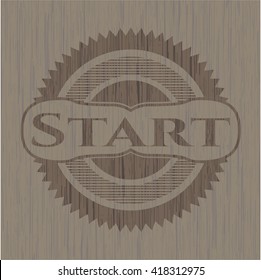 Start badge with wooden background