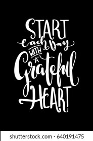 Start Each Day With A Grateful Heart on black Background. Hand Lettering. Modern Calligraphy. Handwritten Inspirational motivational quote.