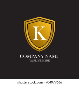 A start letter K with a gold shielded logo with background black