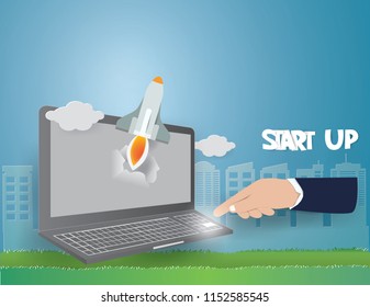 Startup concept with rocket flying out of laptop screen go to sky on blue background,paper craft and illustration.