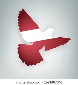 State flag of Latvia (Republic of Latvia) in the shape of a bird. Flying dove flaps its wings on a gray background. Symbol of love and peace concept. Vector illustration