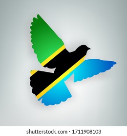 State flag of Tanzania (United Republic of Tanzania) in the shape of a bird. Flying dove flaps its wings on a gray background. Symbol of love and peace concept. Vector illustration