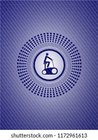 stationary bike icon inside badge with denim texture