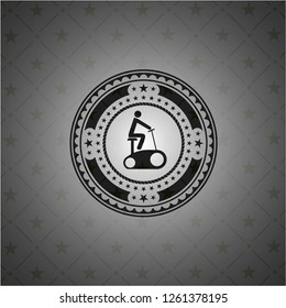 stationary bike icon inside black emblem