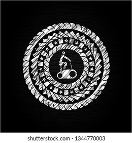 stationary bike icon inside chalk emblem written on a blackboard