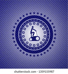 stationary bike icon inside emblem with jean background