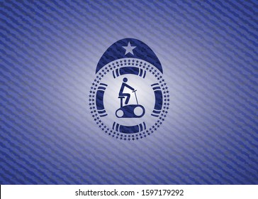 stationary bike icon inside jean or denim emblem or badge background