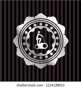 stationary bike icon inside silver badge or emblem